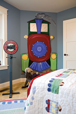 child's bedroom with train wall mural.