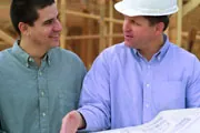 homeowner with contractor reviewing blueprints homeowner with contractor reviewing blueprints