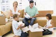 family unpacking boxes in their dream home family unpacking boxes in their dream home