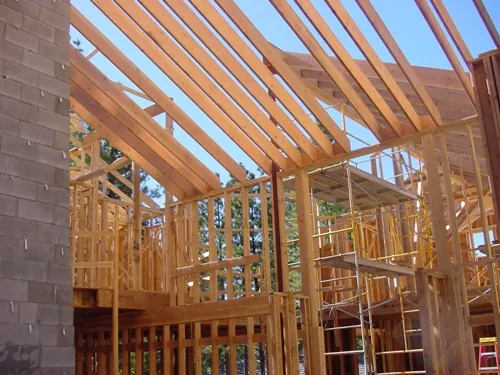 house with framing building a new home