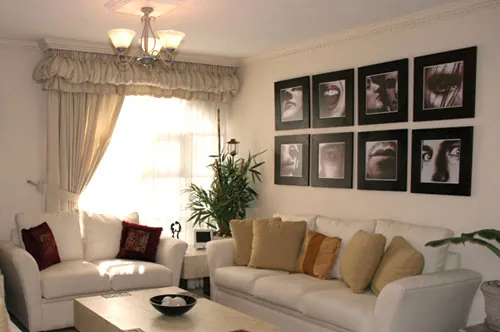 framed picture arrangement above couch in living room framed picture arrangement above couch in living room