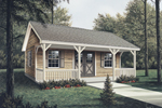 Workroom with covered porch has rustic style double doors on front