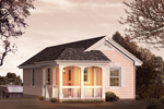 Small cottage style structure with a covered porch is actually an RV garage with a rear entry