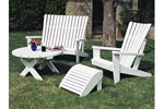 Adirondack quartet includes a round table, ottoman and two chairs all shown painted white for a fresh summer look